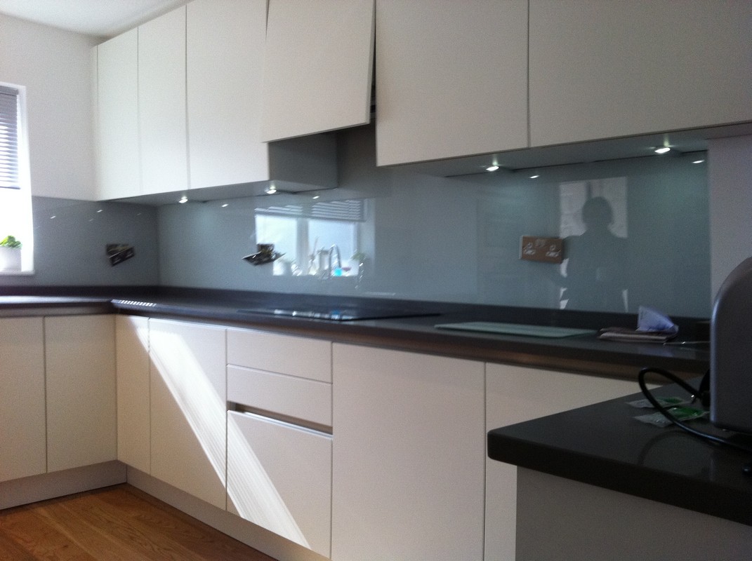 Grey glass kitchen splashback with LED lighting in Wokingham